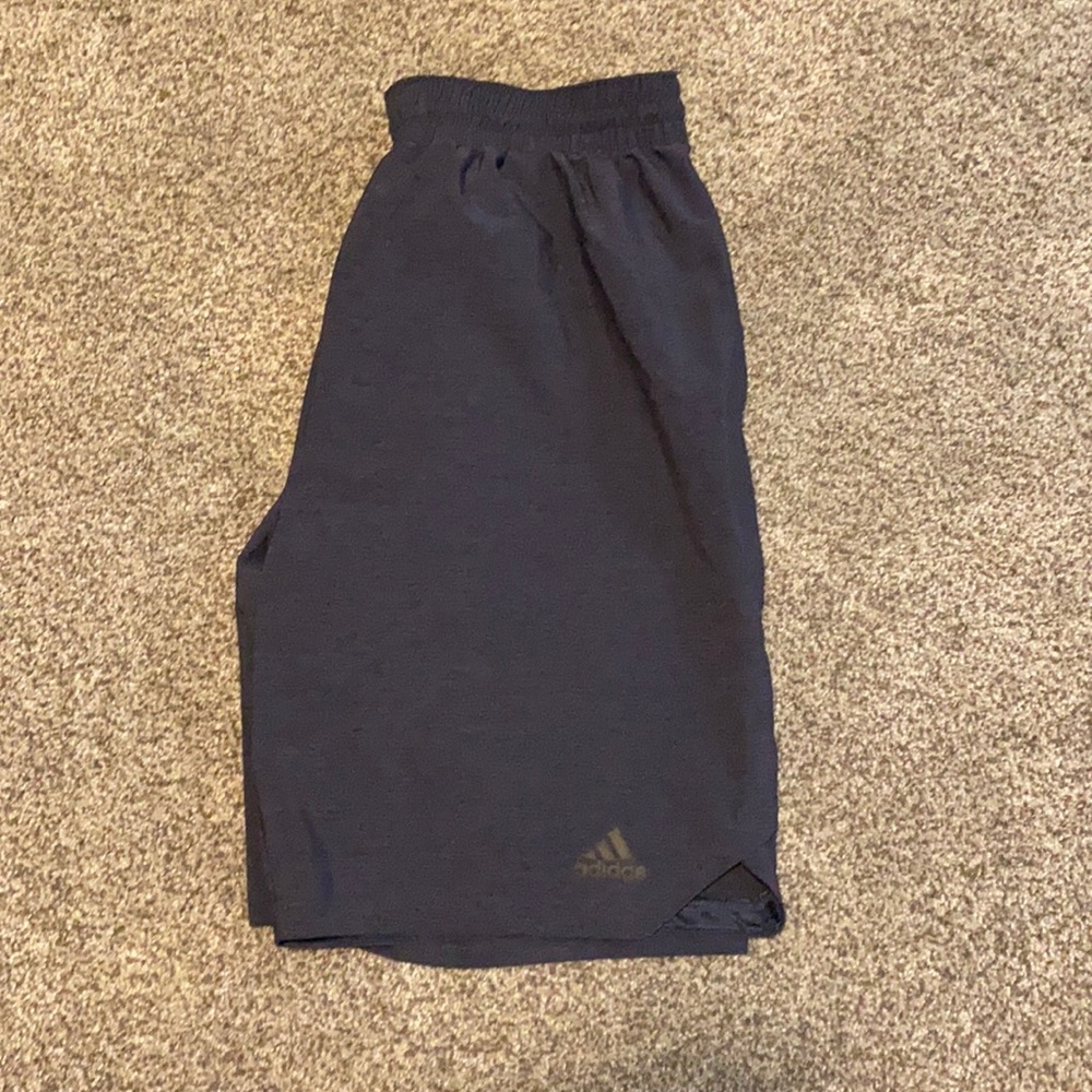 Dark blue Adidas athletic shirt, size large.